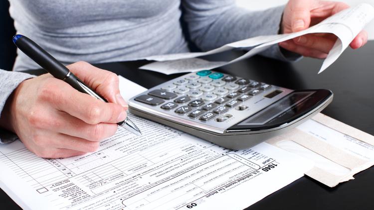 Person filling out tax information 